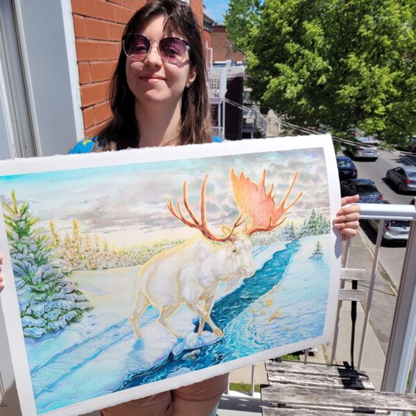 Karolina Szablewska holding up moose painting